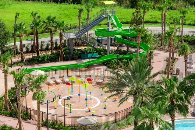 Aerial view of splash pad and waterslide at Las Palmeras by Hilton Grand Vacations resort in Orlando.